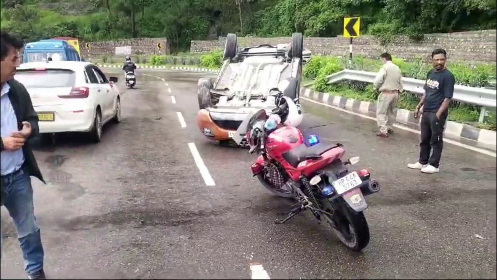 Car overturned on road near Dharampur, all safe