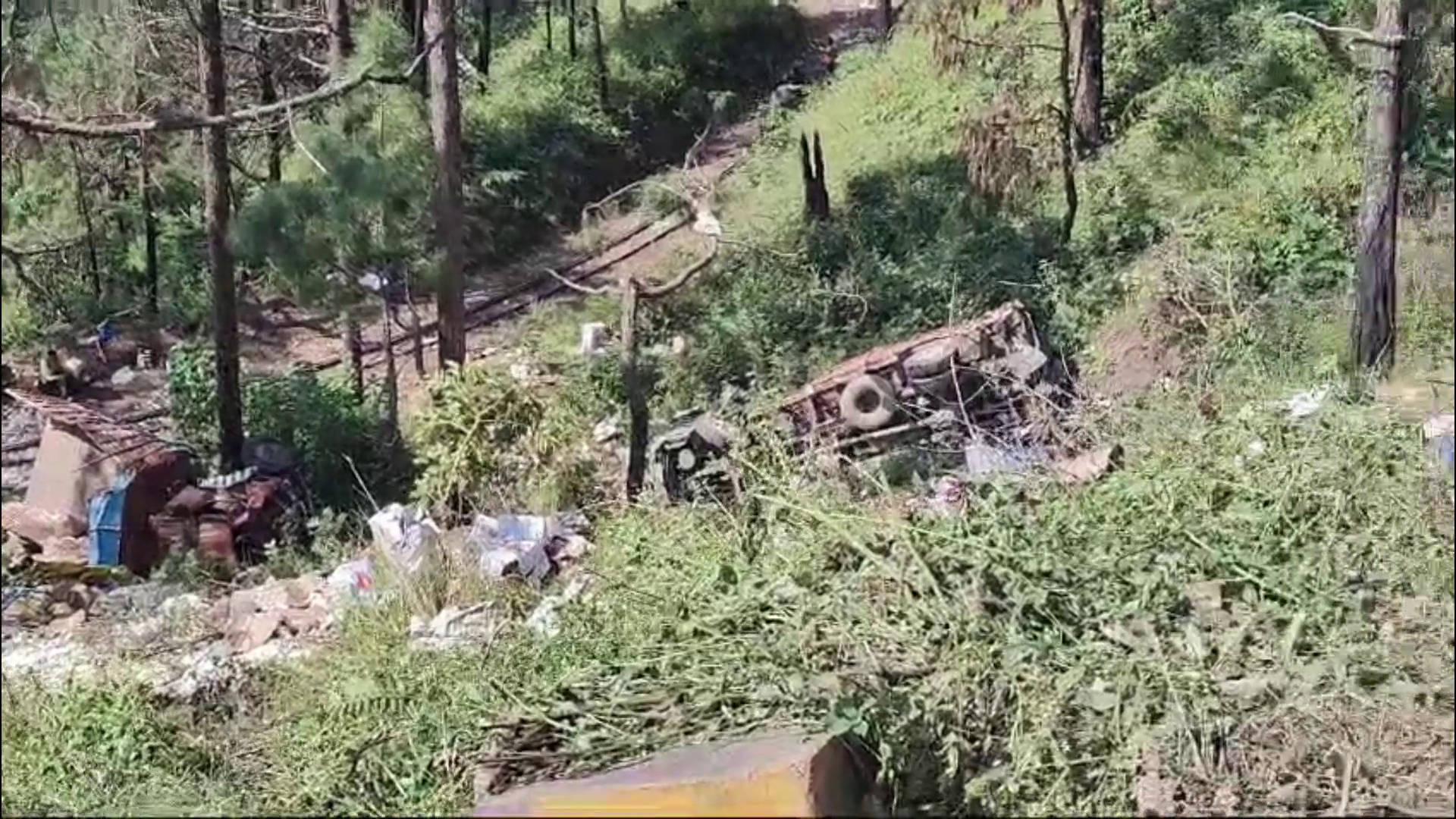 Two trucks fell into a ditch at the same turn in Dharampur