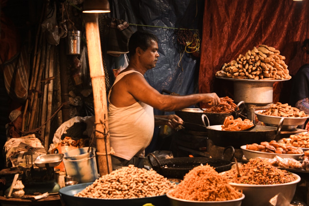 Street vendor at a market stall in India